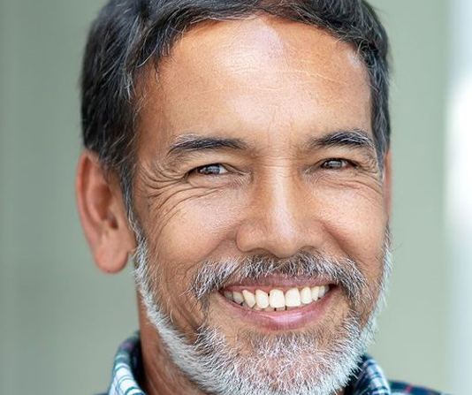 Implant patient showing a very nice smile