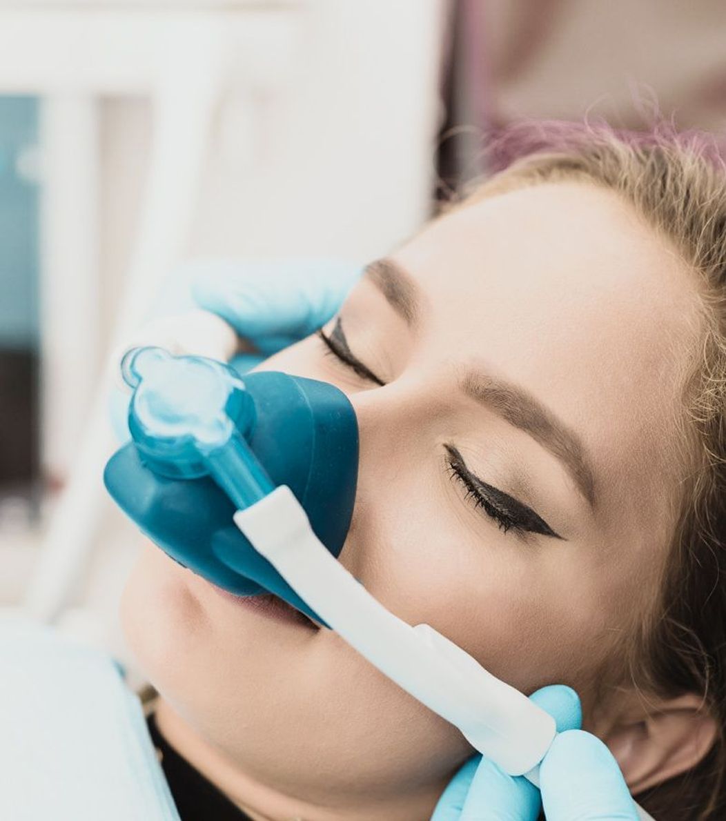 An image of a female patient under dental sedation